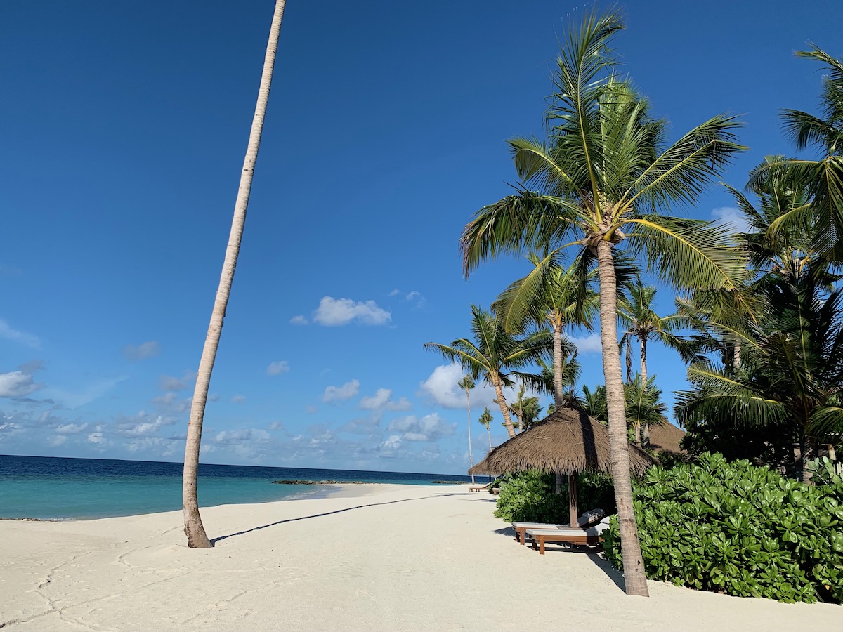 Beach loungers in front of Waldorf Astoria Maldives villa