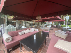 Red outdoor furniture in a hotel courtyard