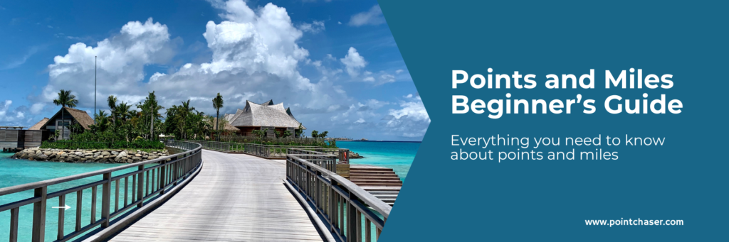 a wooden walkway leading to an overwater villa