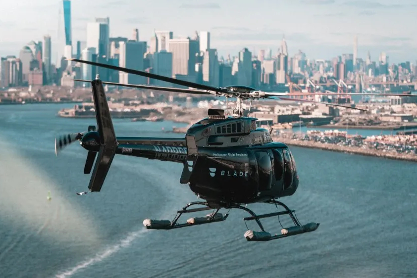 Blade helicopter flying over NYC