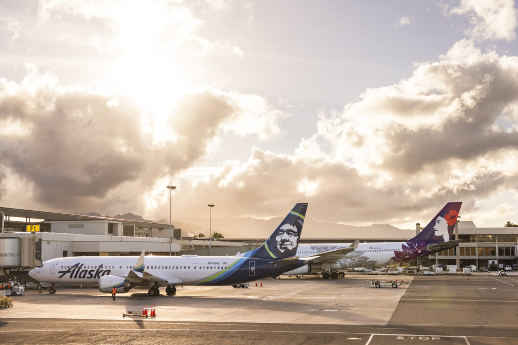 Alaska Airlines and Hawaiian Airlines airplanes on a tarmac