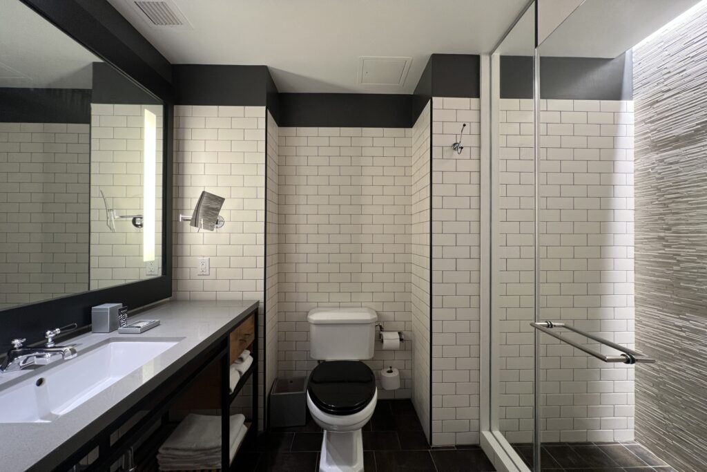 Black and white tiled bathroom at Hotel 50 Bowery in NYC