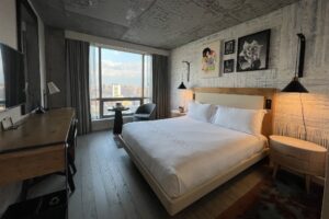 50 bowery hotel room with a bed and a desk