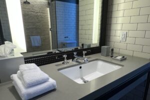 50 bowery hotel bathroom with a sink and a mirror